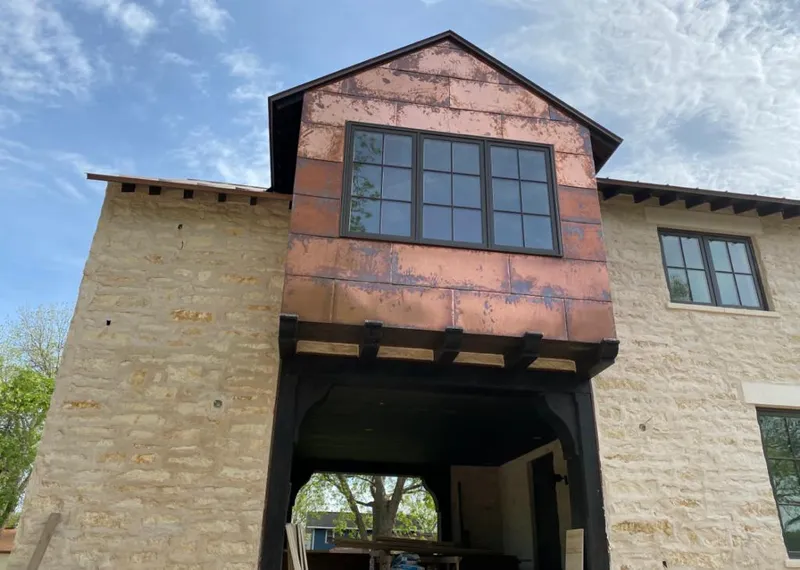 Copper metal panel facade on a stone building for Metal Roof Coating in Boynton Beach