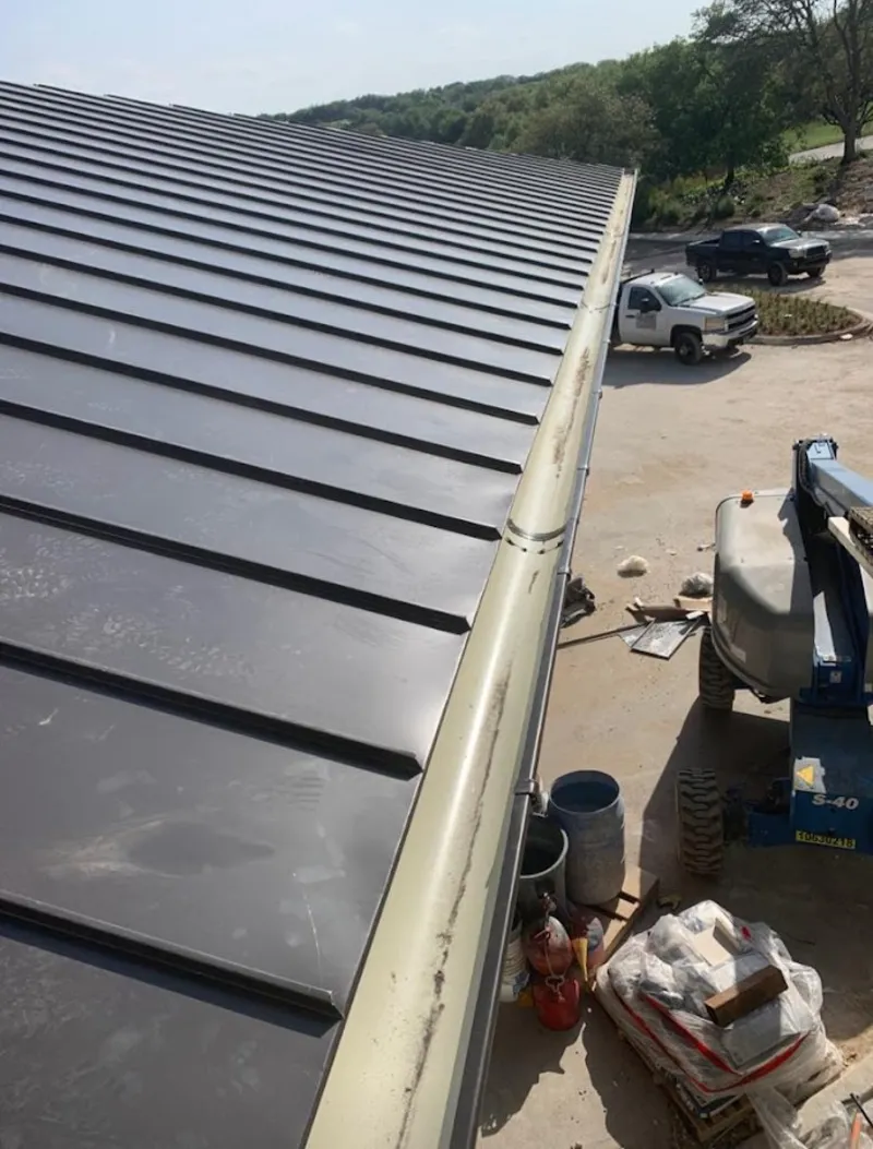 Standing seam panel and gutter detail on a metal roofing jobsite in Boynton Beach